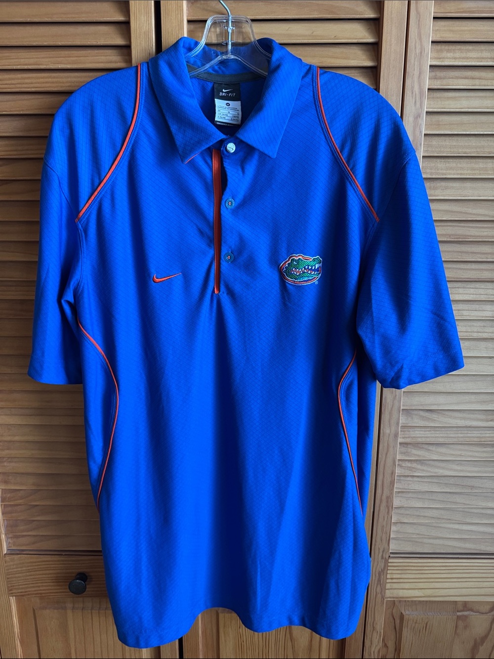 Nike Men’s Royal Blue Polo with Orange Trim and Gators Patch